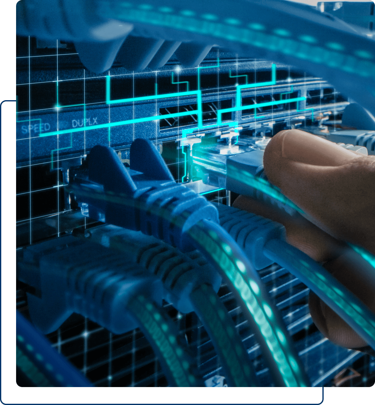 A hand plugs a blue Ethernet cable into a network switch, with other connected cables and illuminated network indicators visible.